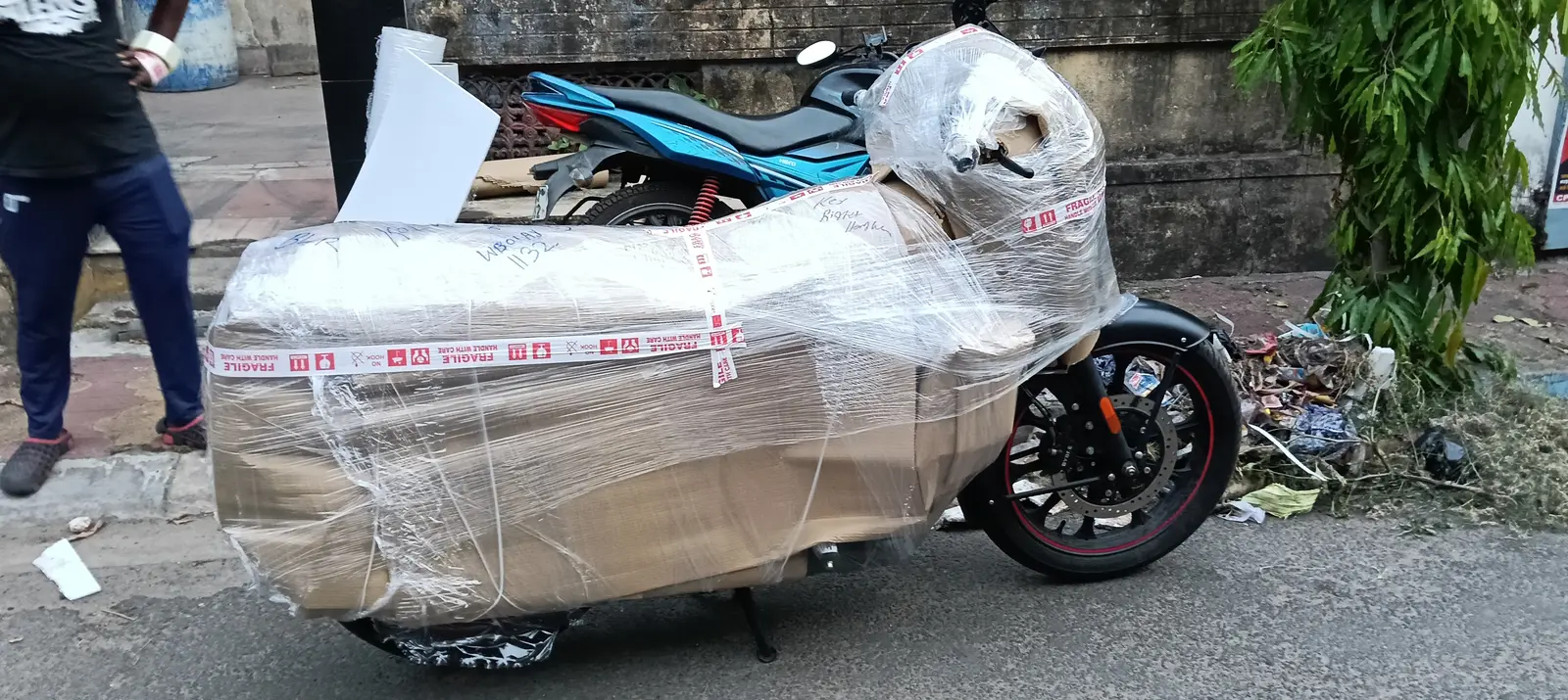 Fully wrapped motorcycle ready for dispatch