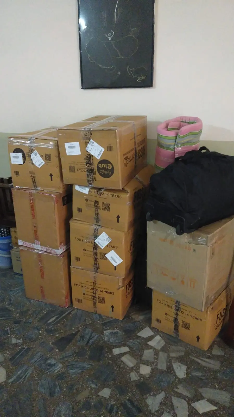Labelled cartons arranged for relocation